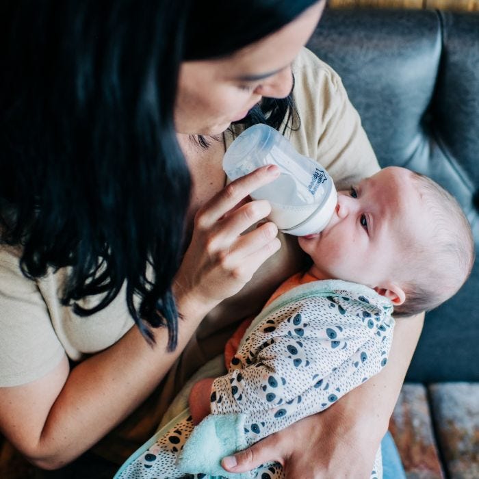 Mum feeding baby with Closer to Nature Baby Bottle