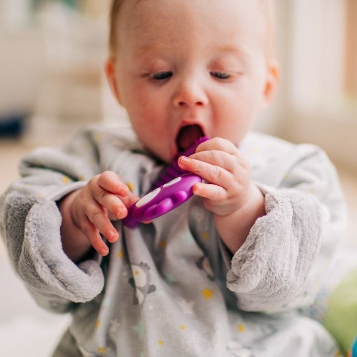 Baby chewing on Kalani sensory mini teether