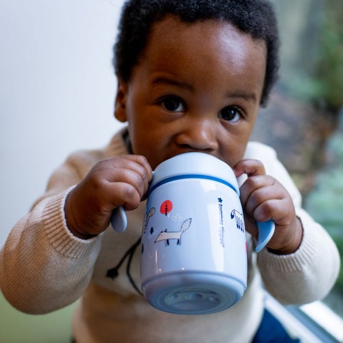 baby with blue superstar training sippee cup