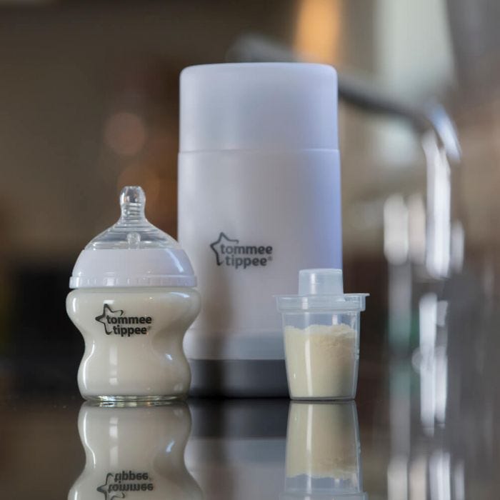 Travel Bottle and Food Warmer on counter top with Tommee Tippee bottle