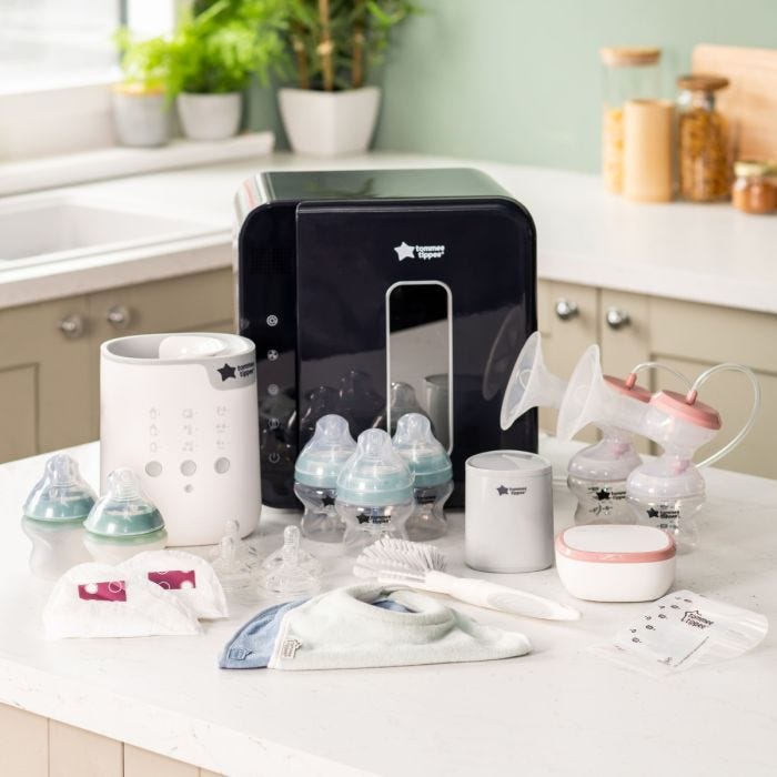 Products included in the ultimate breastfeeding bundle. Including steriliser, perfect prep machine and bottles in kitchen.