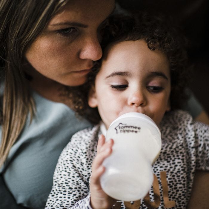baby being fed with a closer to nature bottle
