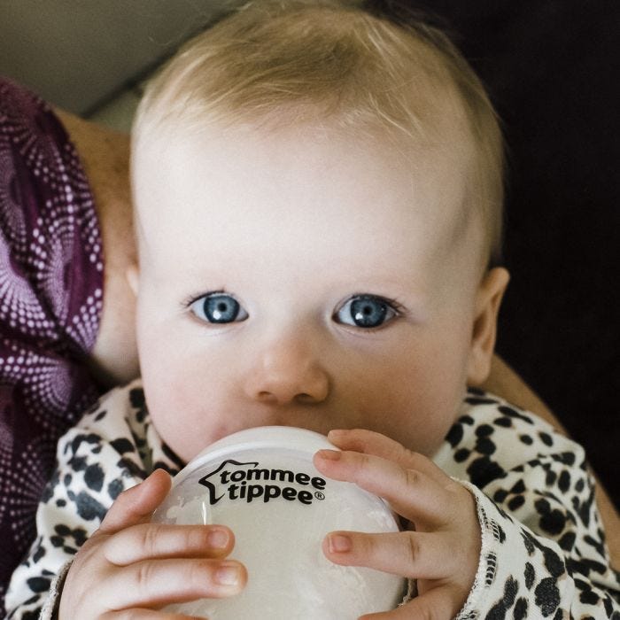 baby being fed with a closer to nature bottle