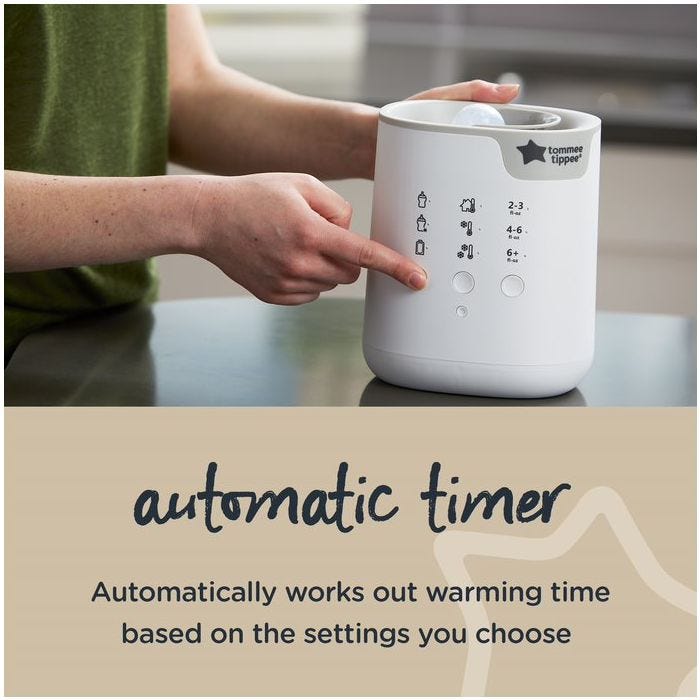 Person setting timer up on a 3-in-1 Advanced Bottle and Pouch Warmer 