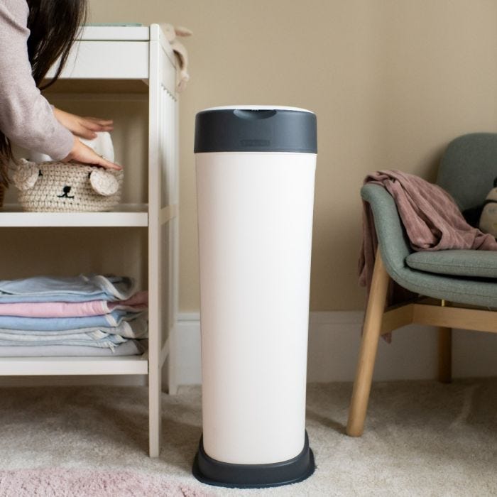Twist & Click XL nappy bin next to baby’s changing table in a nursery