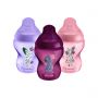 3x 260ml pink, lilac and purple Closer to Nature baby bottles on a white background.