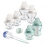 Clear and green Closer to Nature Baby Bottle Starter Set with 6x bottles, brush, 1x soother on a white background.