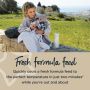 Woman pouring a formula feed into a sterile baby bottle with text about making a fresh formula feed