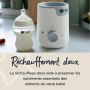 Chauffe-biberon à côté d&apos;un biberon rempli avec un texte sur le réchauffement doux