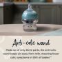 Advanced Anti-Colic baby bottle on a kitchen counter with text about the anti-colic wand