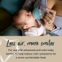 Baby in mom’s arms drinking from an Advanced Anti-Colic bottle with text below stating these bottles reduce colic symptoms.