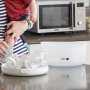 inserting-bottle-into-micro-steam-steriliser