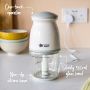Mini baby food blender on a kitchen counter with text about its one-touch operation, non-slip base and 500ml glass bowl