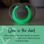 Nighttime pacifier with glowing handle alongside text that explains it glows in the dark.