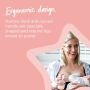 Mom breastfeeding baby and holding manual breast pump at other breast with text highlighting the ergonomic design of the pump.