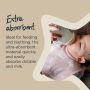 Baby wearing a pink milk feeding bib with text describing how the material is extra absorbent to ideal for teething and feeding.