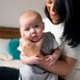 mum holding baby swaddle in The Original Grobag Swaddlebag