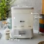 White Steridryer with pointers to its three settings and tiered rack