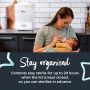 Woman feeding her baby in the kitchen with a Steridryer behind her and text about staying organised