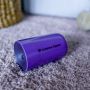 Purple 360 cup lying flat on a carpet