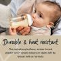 Baby sitting on mum’s knee about to drink from a PPSU baby bottle with stating the breast-like teat feels closer to skin.