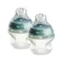 Two Natural Start Silicone baby bottles against a white background