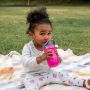 Close up of little girl holding the orange insulated straw cup