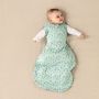 baby wearing Tommee Tippee treasure trees snuggle with both arms extended