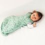 baby wearing Tommee Tippee treasure trees snuggle with both arms raised