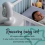 Baby in cot with baby unit pointed towards them. Text describing the features of the reassuring baby unit.