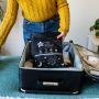 mum packing blind into suitcase