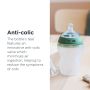 Natural Start Silicone baby bottle on a kitchen table with text about the anti-colic valve