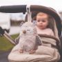 Travel Mini Owl Sleep Aid hanging on pushchair