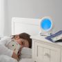 girl in bed cuddling ollie the owl grofriend with groclock on bedside table