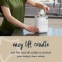 Person using the the easy lift cradle on a 3-in-1 Advanced Bottle and Pouch Warmer