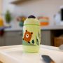 Superstar Sipper Training Cup, green on tabletop