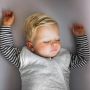 Child sleeping in The Original Grobag Grey Marl Sleepbag