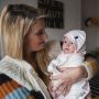 baby girl swaddle in penny the penguin dry towel