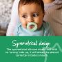 Baby with green breast-like night pacifier in mouth with describing the benefits of the symmetrical orthodontic design.