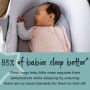 Baby sleeping in moses basket with text about how 85% of babies sleep better in our sleepbags