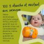 Tasse d&apos;apprentissage orange posée à plat sur une table, avec texte sur la valve anti-fuite