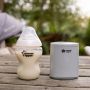 LetsGo bottle warmer and Closer to Nature baby bottle placed on a picnic bench