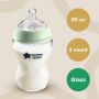 Glass baby bottle on beige background with roundels stating 9fl oz, 3 count, glass.