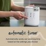 Person setting timer up on a 3-in-1 Advanced Bottle and Pouch Warmer 