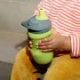 Close up of toddler holding green Sportee cup
