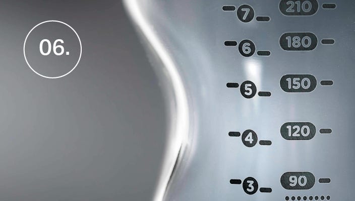 a close up of the measurement markers on a Tommee Tippee baby bottle 