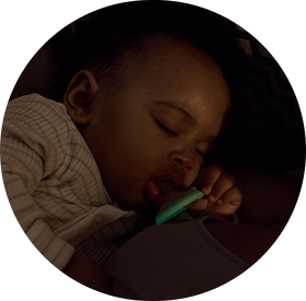 a baby sleeping with a tommee tippee in his mouth