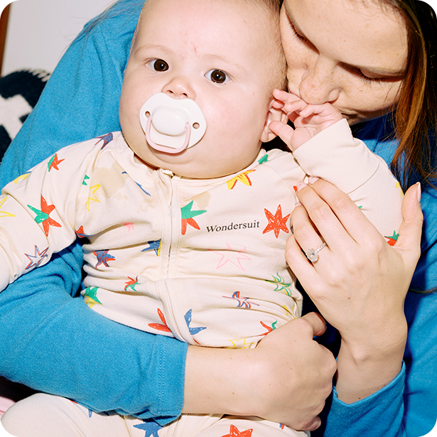 An image of a baby with a tommee tippee moda soother in her mouth